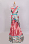 Peach butta designed lehanga with contrast floral design border and contrast blouse paired with matching floral butta motifs shawl