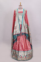Peach butta designed lehanga with contrast floral design border and contrast blouse paired with matching floral butta motifs shawl