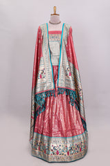 Peach butta designed lehanga with contrast floral design border and contrast blouse paired with matching floral butta motifs shawl