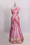 Pink butta designed lehanga with contrast floral design border and contrast blouse paired with matching floral butta motifs shawl