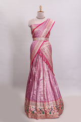 Pink butta designed lehanga with contrast floral design border and contrast blouse paired with matching floral butta motifs shawl