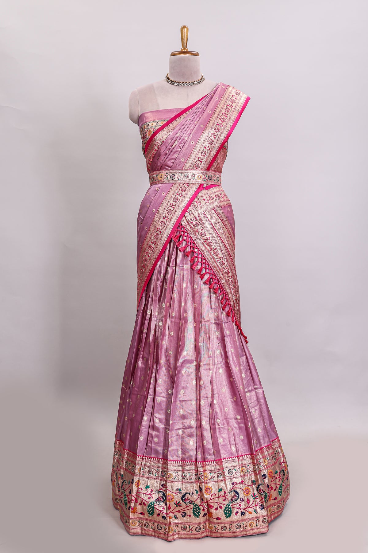 Pink butta designed lehanga with contrast floral design border and contrast blouse paired with matching floral butta motifs shawl