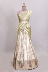 Gold shade lehanga with self manga motif border and light green shade contrast blouse paired with plain shawl with floral motifs