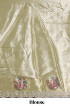 Gold shade lehanga with self manga motif border and light green shade contrast blouse paired with plain shawl with floral motifs