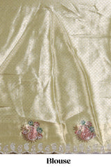 Gold shade lehanga with self manga motif border and light green shade contrast blouse paired with plain shawl with floral motifs