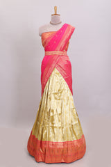 Ivory gold shade geometric zari lehanga featuring contrast border and matching blouse paired with contrast pink shawl