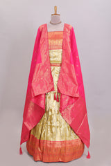 Ivory gold shade geometric zari lehanga featuring contrast border and matching blouse paired with contrast pink shawl