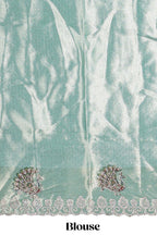 Off white tissue lehenga featuring intricate woven floral paisley motifs with a beautiful zari border Paired with a seafoam green shawl