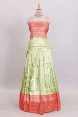 Pastel green Manga Butta motifs lehanga featuring contrasting border and matching blouse paired with contrast red shawl