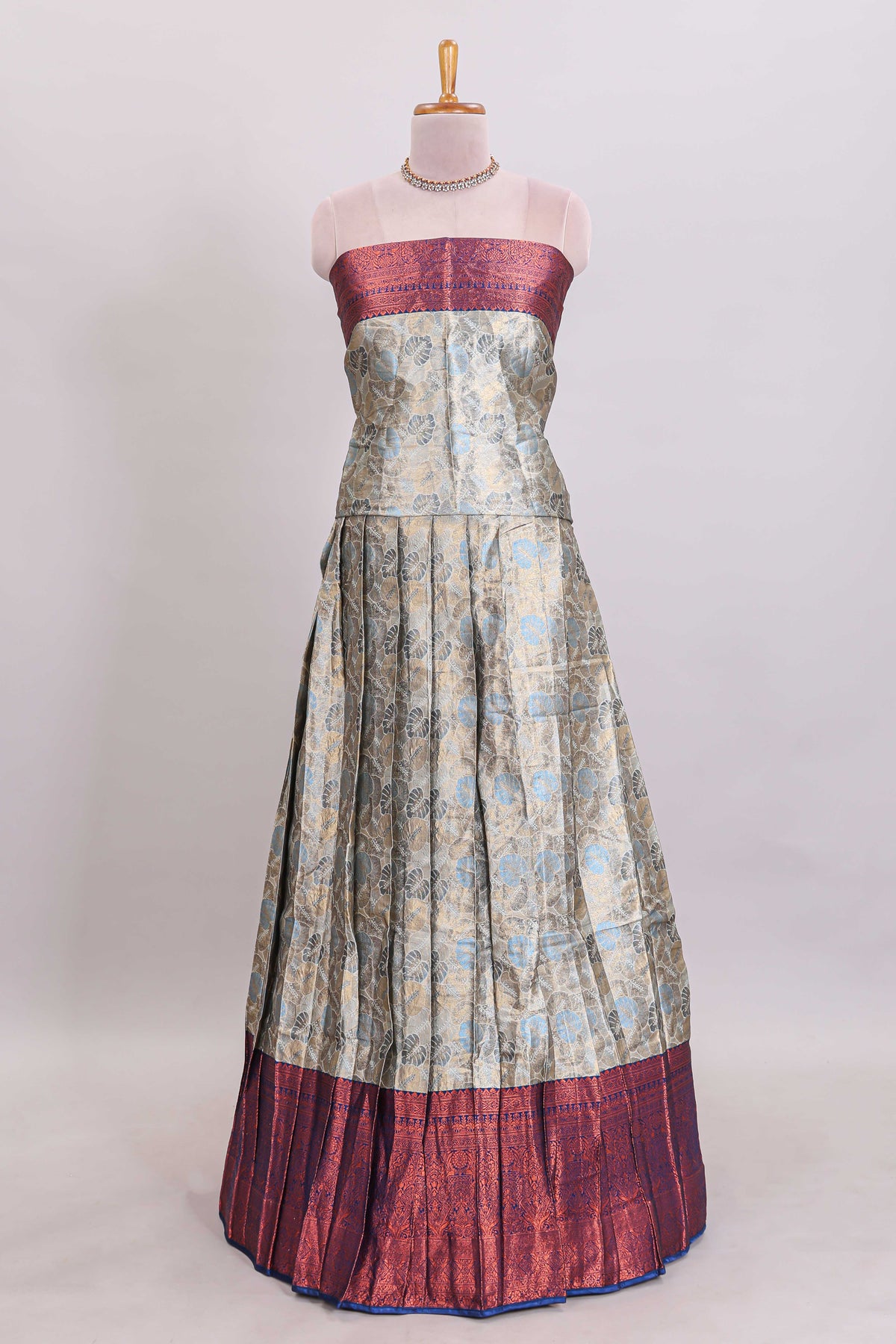 Antique ivory unique designed lehanga featuring contrasting border and matching blouse paired with contrast navy blue shawl
