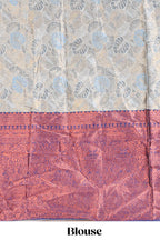 Antique ivory unique designed lehanga featuring contrasting border and matching blouse paired with contrast navy blue shawl