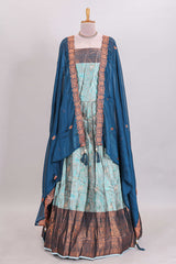 Light aqua blue floral and deer motifs lehanga featuring contrasting geometric zari border and matching blouse paired with contrast blue shawl