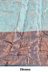 Light aqua blue floral and deer motifs lehanga featuring contrasting geometric zari border and matching blouse paired with contrast blue shawl