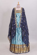 Light blue shade manga motifs lehanga featuring contrasting zari border and matching blouse paired with  navy blue organza shawl