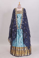 Light blue shade manga motifs lehanga featuring contrasting zari border and matching blouse paired withnavy blue organza shawl