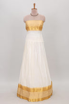 White plain lehanga featuring matching blouse paired with green stone work dhavani