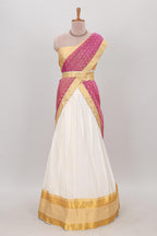 White plain lehanga featuring matching blouse paired with pink stone work dhavani