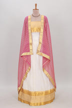 White plain lehanga featuring matching blouse paired with pink stone work dhavani