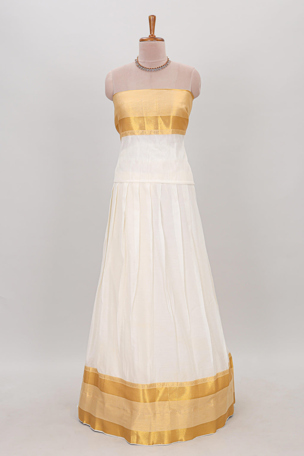 White plain lehanga featuring matching blouse paired with pink stone work dhavani