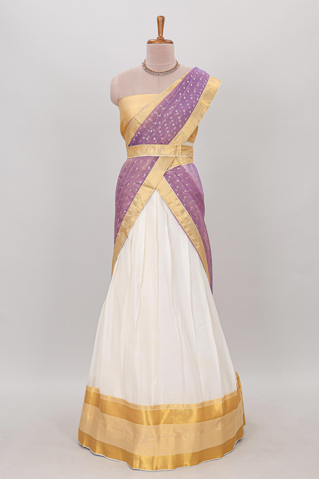 White plain lehanga featuring matching blouse paired with lavender stone work dhavani