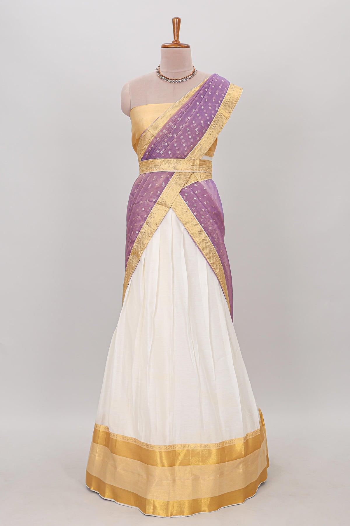 White plain lehanga featuring matching blouse paired with lavender stone work dhavani
