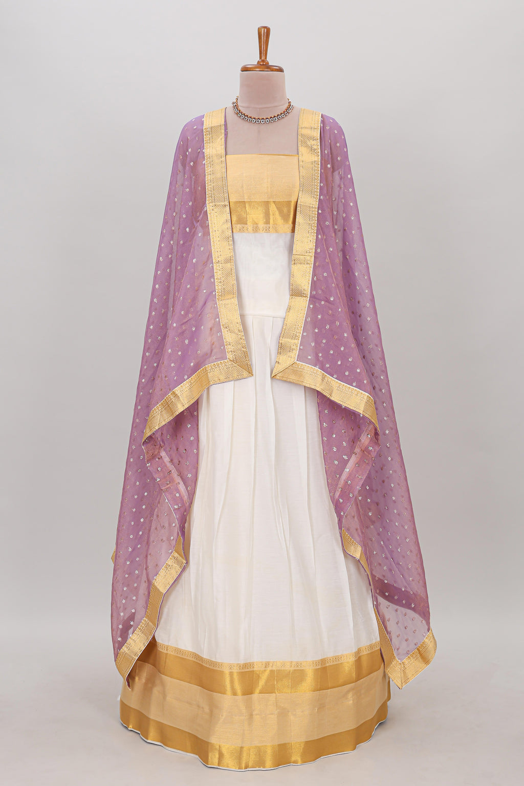 White plain lehanga featuring matching blouse paired with lavender stone work dhavani
