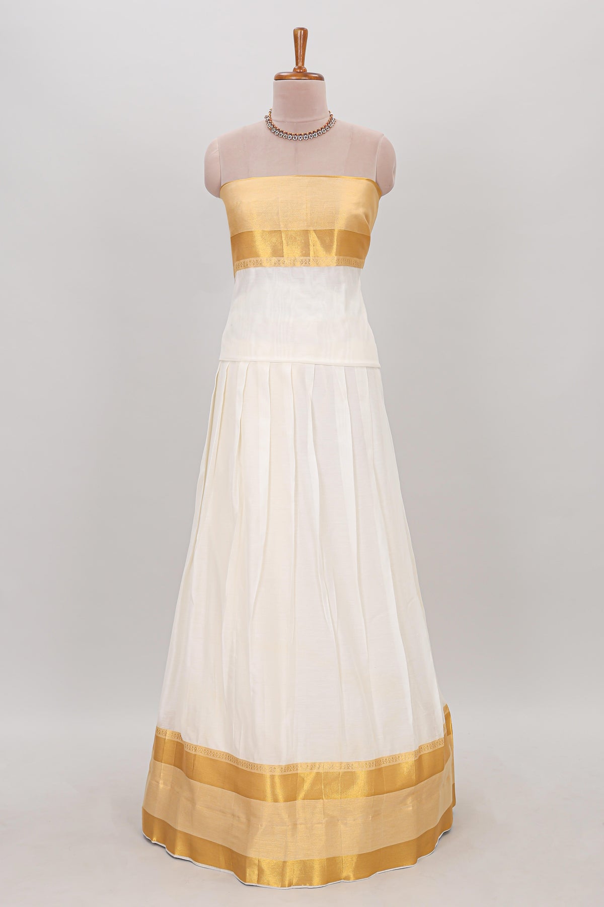 White plain lehanga featuring matching blouse paired with grey stone work dhavani