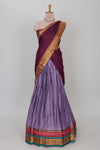 Lavender shade plain lehanga featuring contrasting zari border and blouse paired withmaroonshawl