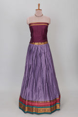 Lavender shade plain lehanga featuring contrasting zari border and blouse paired withmaroonshawl