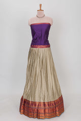 Beige shade plain lehanga featuring contrasting zari border and blouse paired with violet shawl