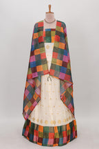 White zari butta designed lehanga featuring matching blouse paired with dhavani featuring madras checks