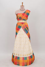 White zari butta designed lehanga featuring matching blouse paired with multicolor dhavani featuring madras checks