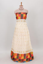 White zari butta designed lehanga featuring matching blouse paired with multicolor dhavani featuring madras checks