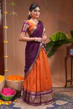 Orange plain half saree with matching blouse and contrast zari border and dhavani