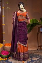 Orange plain half saree with matching blouse and contrast zari border and dhavani