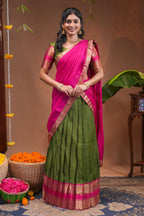 Green plain half saree with matching blouse and contrast zari border and dhavani