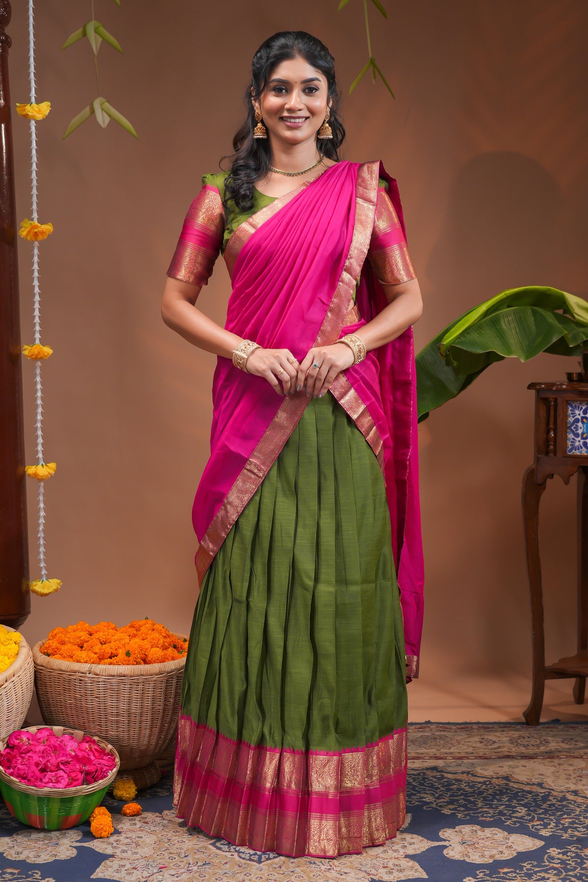 Green plain half saree with matching blouse and contrast zari border and dhavani