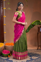 Green plain half saree with matching blouse and contrast zari border and dhavani