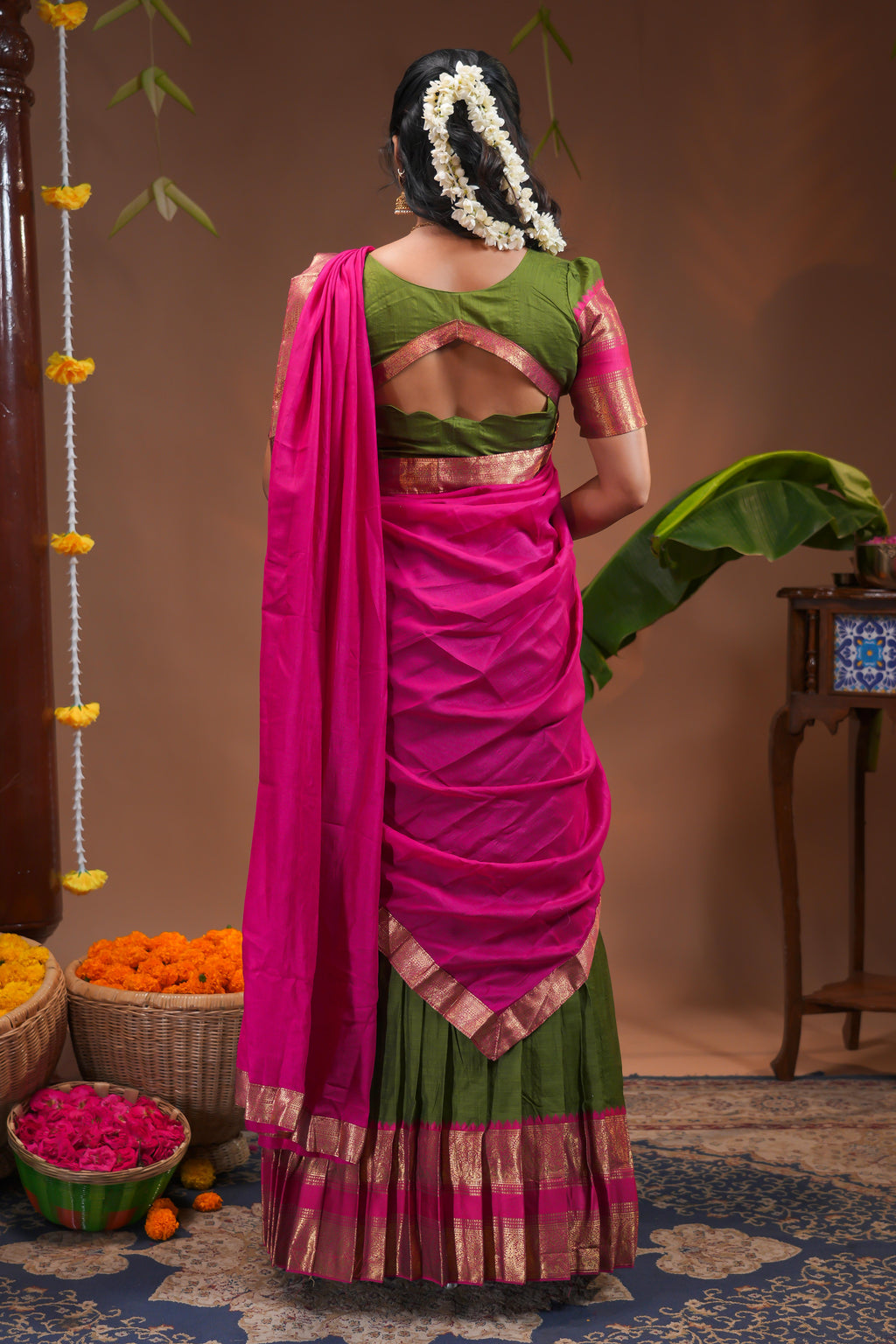 Green plain half saree with matching blouse and contrast zari border and dhavani