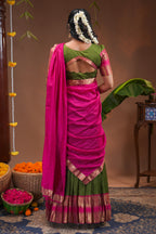 Green plain half saree with matching blouse and contrast zari border and dhavani