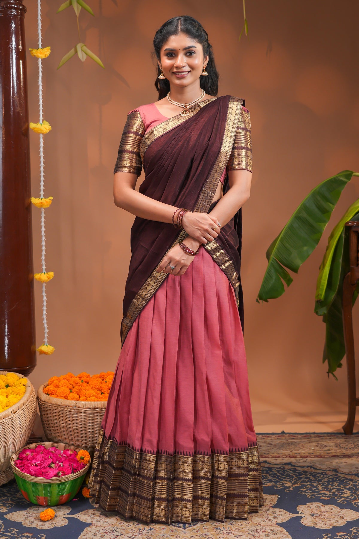 Pinky peach plain half saree with matching blouse and contrast zari border and  dhavani