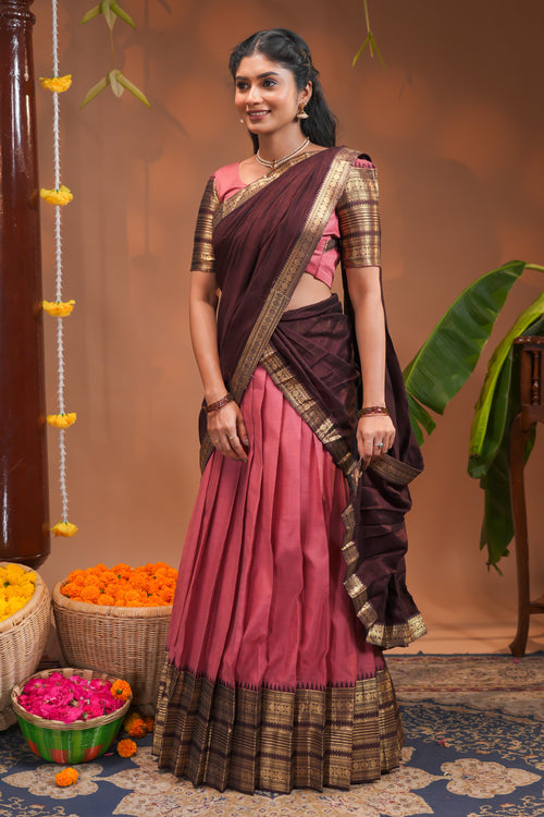 Pinky peach plain half saree with matching blouse and contrast zari border and  dhavani