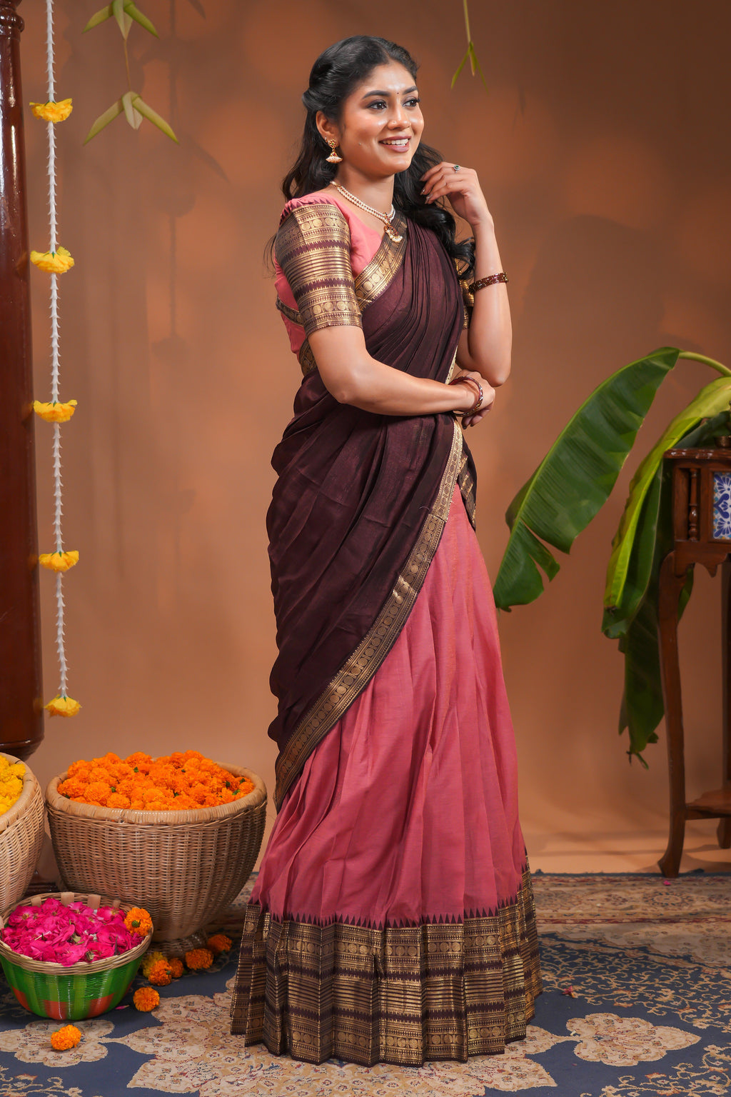 Pinky peach plain half saree with matching blouse and contrast zari border and  dhavani