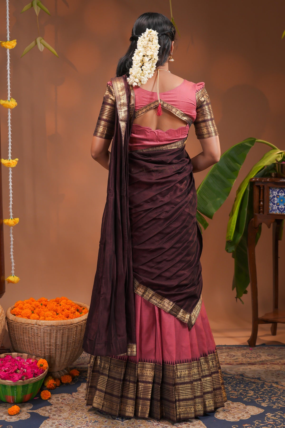 Pinky peach plain half saree with matching blouse and contrast zari border and  dhavani