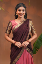 Pinky peach plain half saree with matching blouse and contrast zari border and  dhavani