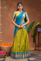 Green plain half saree with matching blouse and contrast zari border and  dhavani