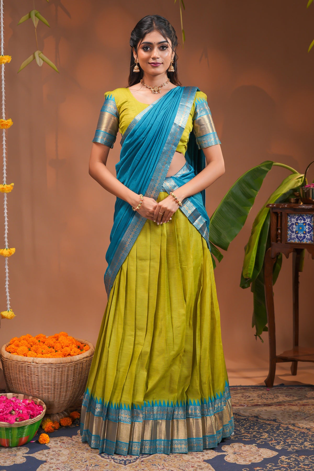 Green plain half saree with matching blouse and contrast zari border and  dhavani