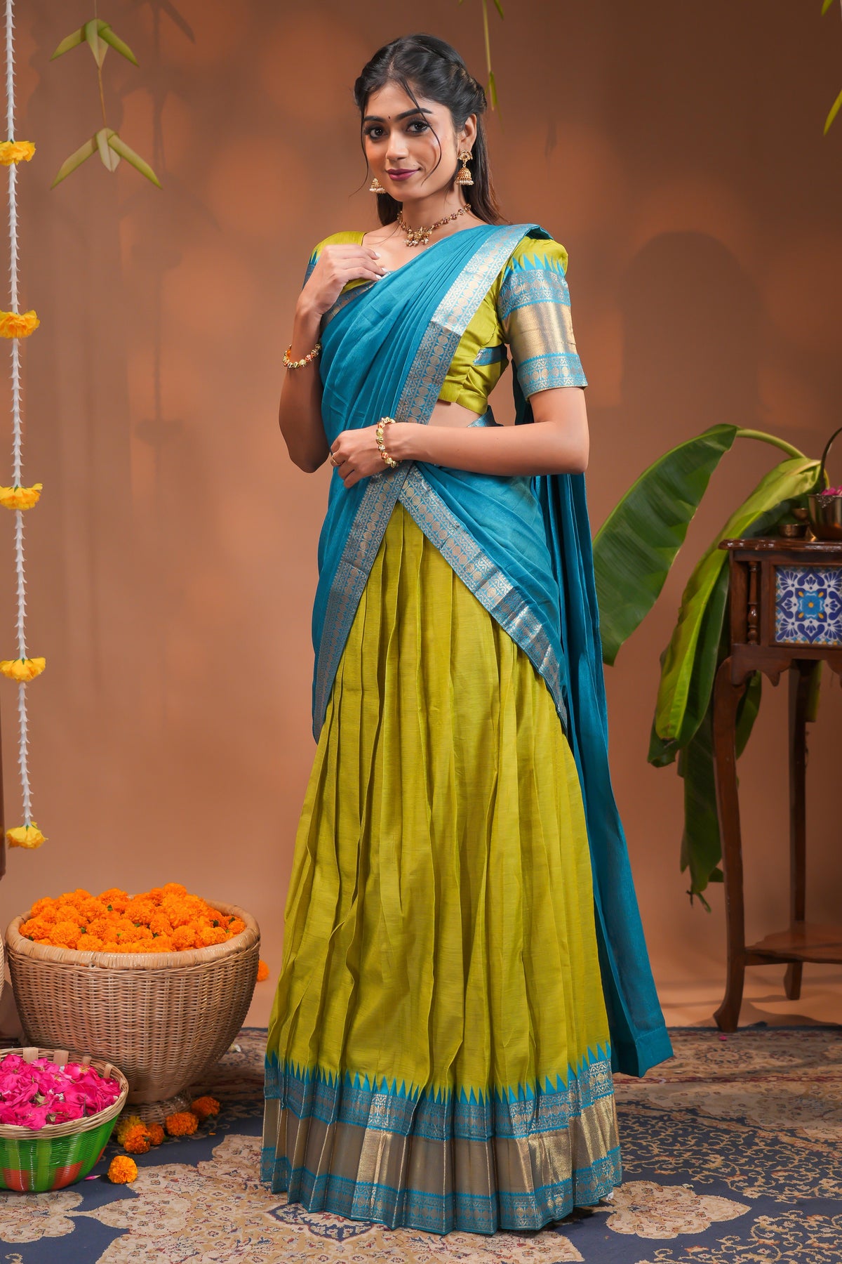 Green plain half saree with matching blouse and contrast zari border and  dhavani