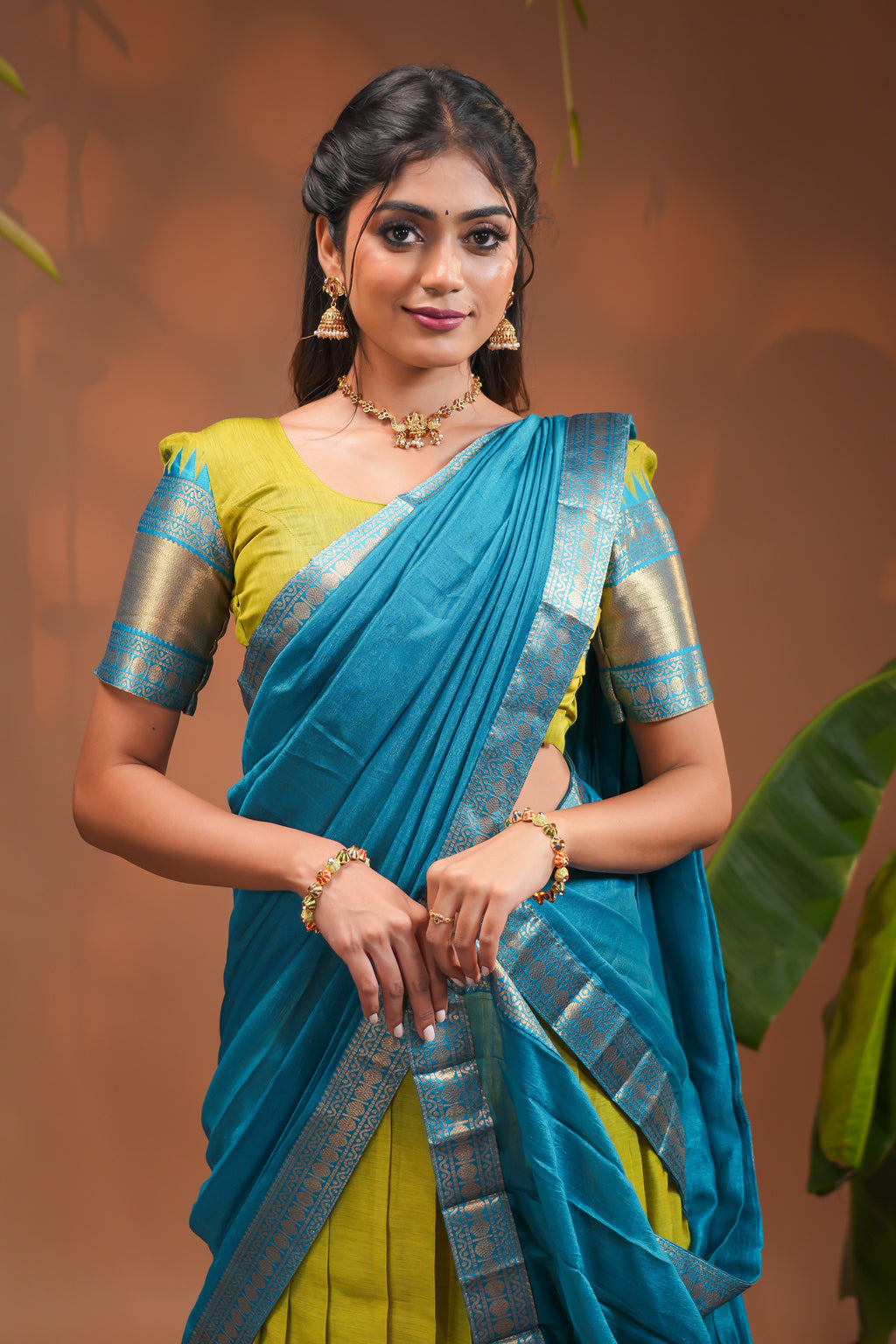 Green plain half saree with matching blouse and contrast zari border and  dhavani