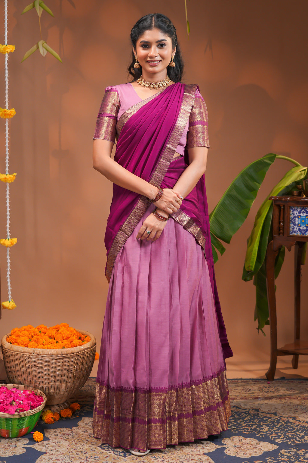 Pink plain half saree with matching blouse and contrast zari border and  dhavani